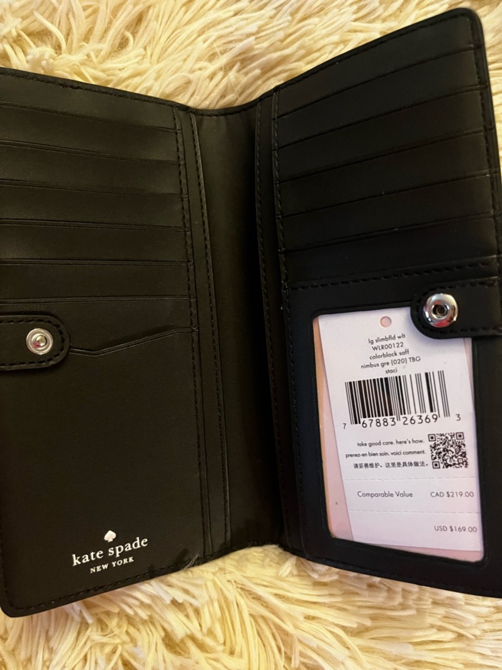 kate spade black leather bi-fold wallet with ID window